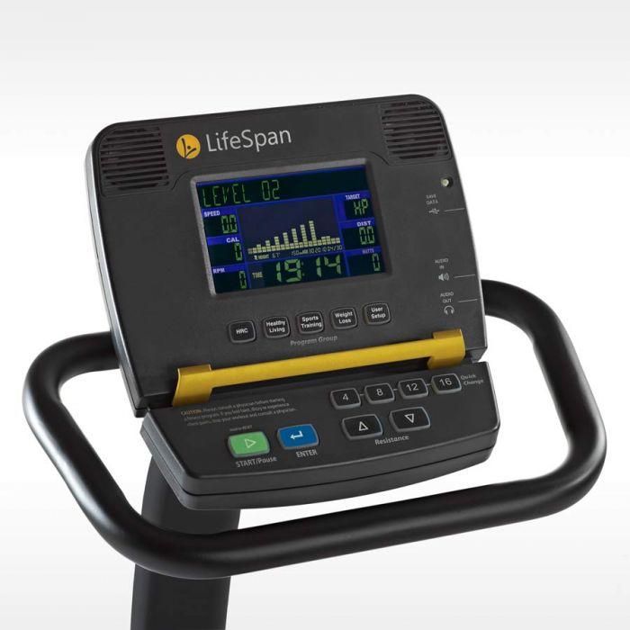Closeup of a display console on a black and yellow exercise bike.